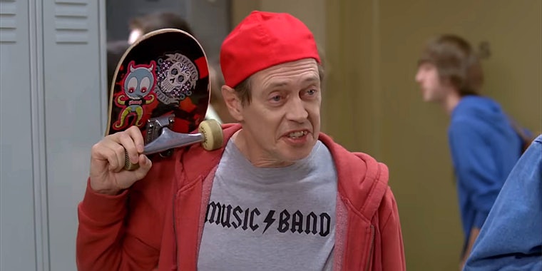 steve buscemi wearing 'music band' t-shirt and carrying a skateboard