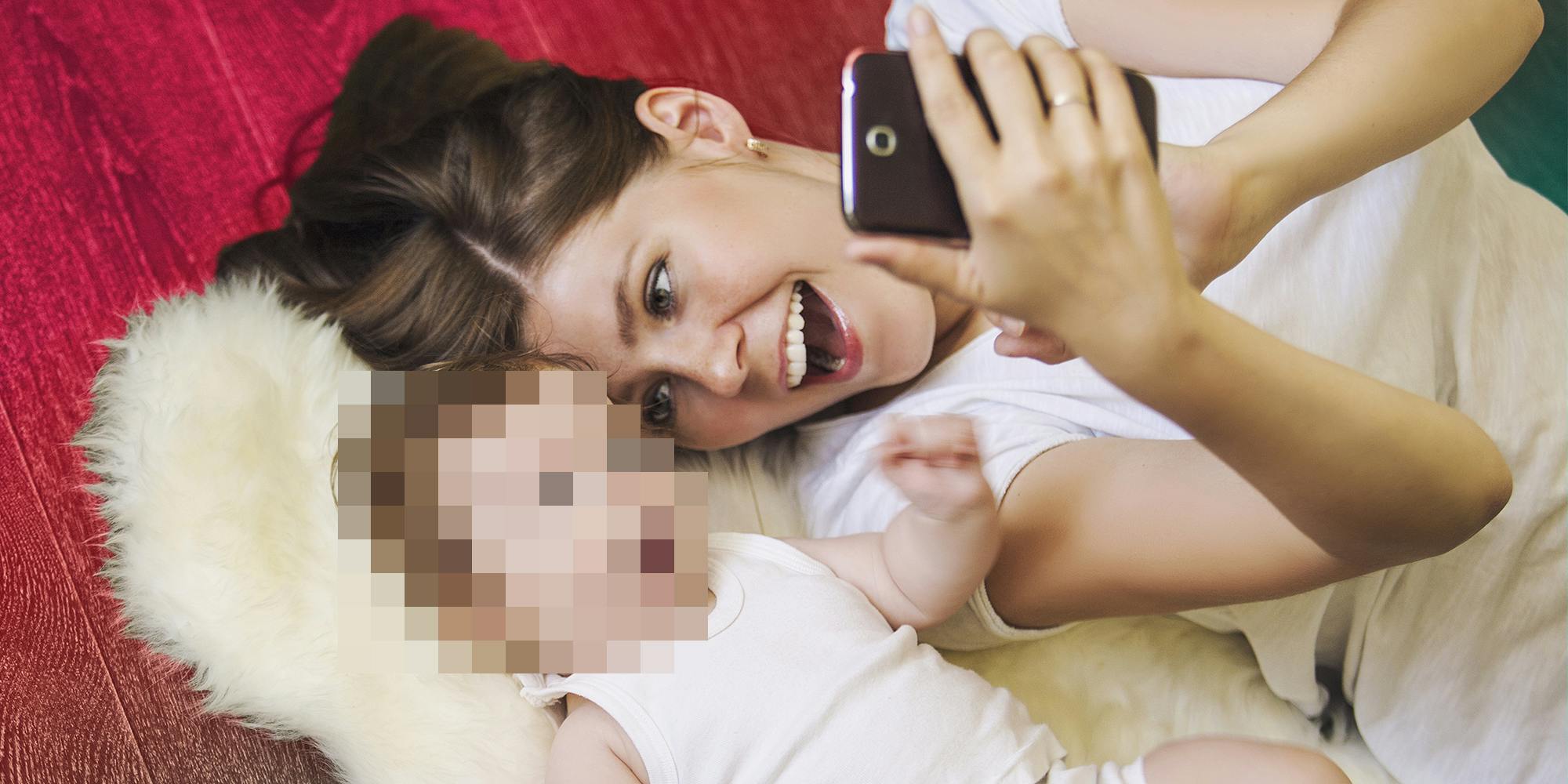 Mother with child's face pixelated