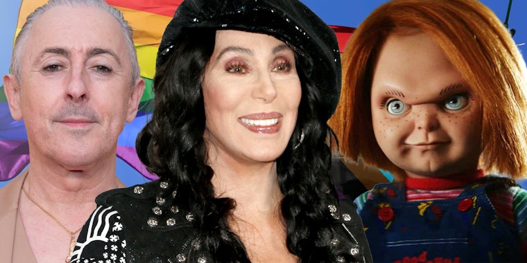 Alan Cumming(l), Cher(c), Chucky Doll(r) in front of lgbtqia flag
