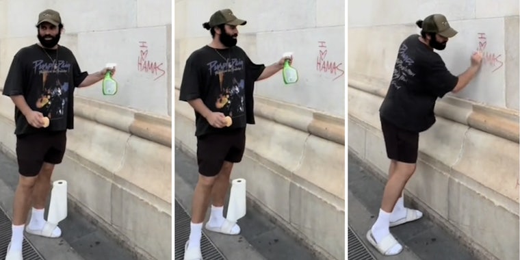 Man with cleaning products cleaning grafitti that says 'I heart hamas'